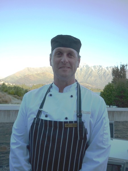 Chef Wayne Booth at the Heritage Queenstown with The Remarkables mountain range in the background   